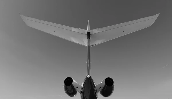 Tail section of a business jet from behind.