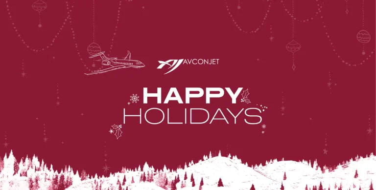 White outline of a jet flying over snowy hills and pine trees with the message “Happy Holidays” in bold white text, set on a deep red background with holiday ornaments and the Avcon Jet logo above. Snowflakes and holly decorate the text for a festive touch.